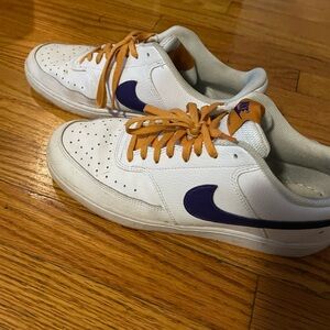 White and Purple Sneakers with Orange Laces